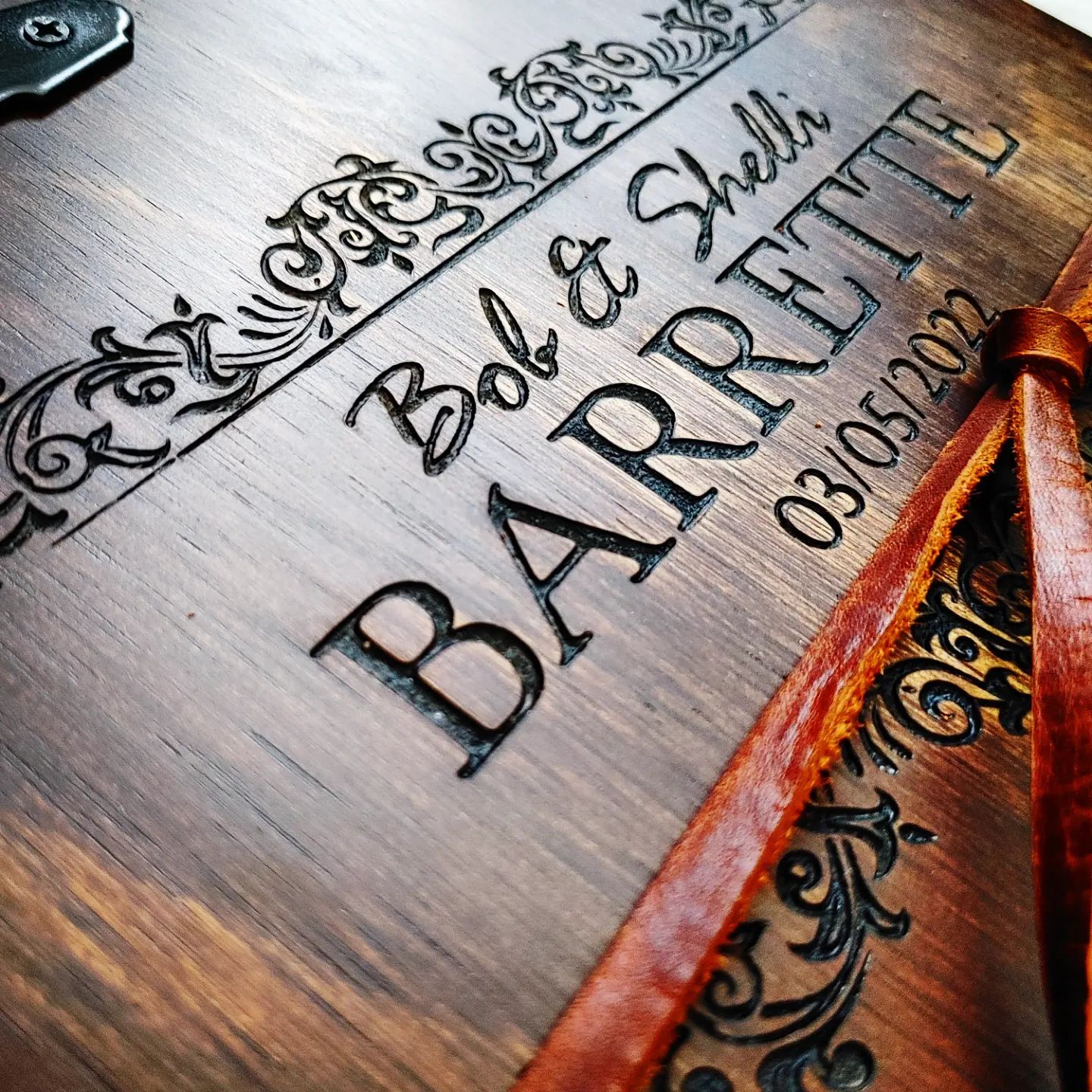 Personalized wedding guest book from Rustic Engravings featuring engraved names and date for treasured memories.