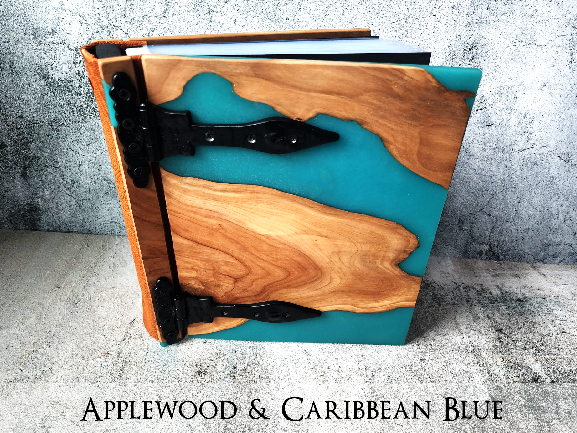  Capture travel memories in a custom journal with a distinctive river table wood and epoxy cover by Tylir Wisdom at Rustic Engravings.