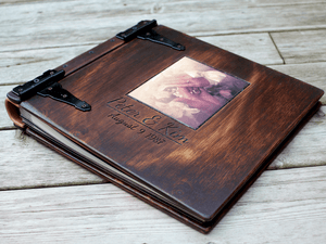 Preserve your family's legacy with a personalized family heirloom photo album from Rustic Engravings. Crafted from high-quality wood and adorned with unique engravings, this album provides ample space to showcase your most treasured memories. It's a true 