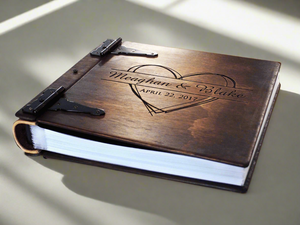 Personalized family photo album by Rustic Engravings |A treasure trove of memories. Each album, crafted by artist Tylir Wisdom, tells your family's story with heartwarming detail. A perfect keepsake for any family, order yours today.