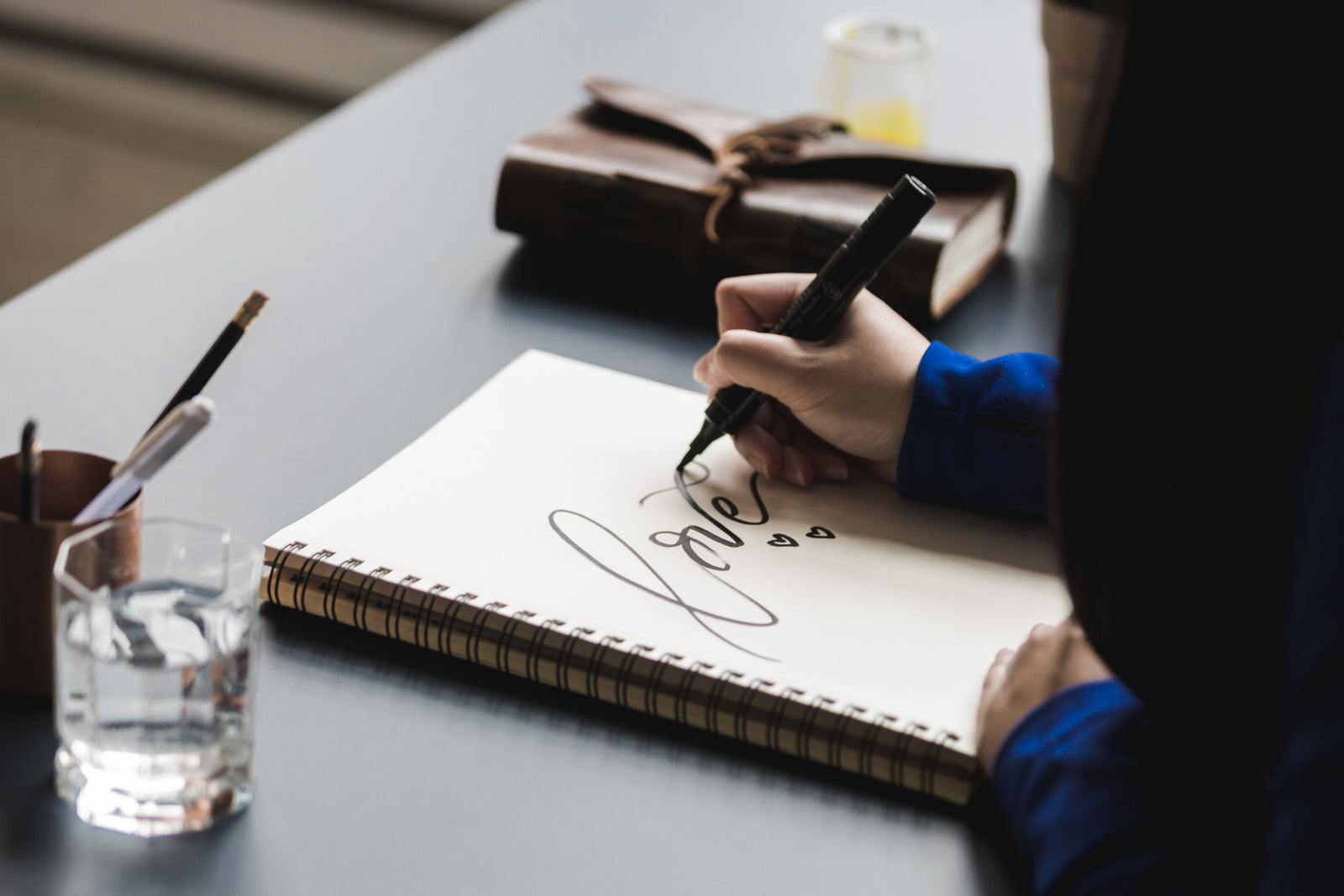 Creating a unique wedding guest book design at Rustic Engravings for your special day.