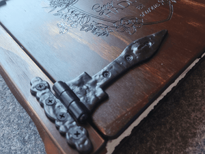 Looking for the perfect way to add a touch of rustic charm to your custom photo album? Look no further than Rustic Engravings' black cast iron hinges. Our T-shaped hinges with a rustic hammered finish are expertly crafted to complement our wooden books and showcase your precious memories in style. Upgrade your photo album today and enjoy the premium quality and timeless elegance of our cast iron hinges.