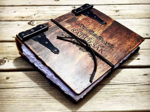 Wood and Leather Travel Scrapbook | Capture your travels in style with this wood and leather-bound travel scrapbook by Rustic Engravings - the perfect way to preserve your travel memories.