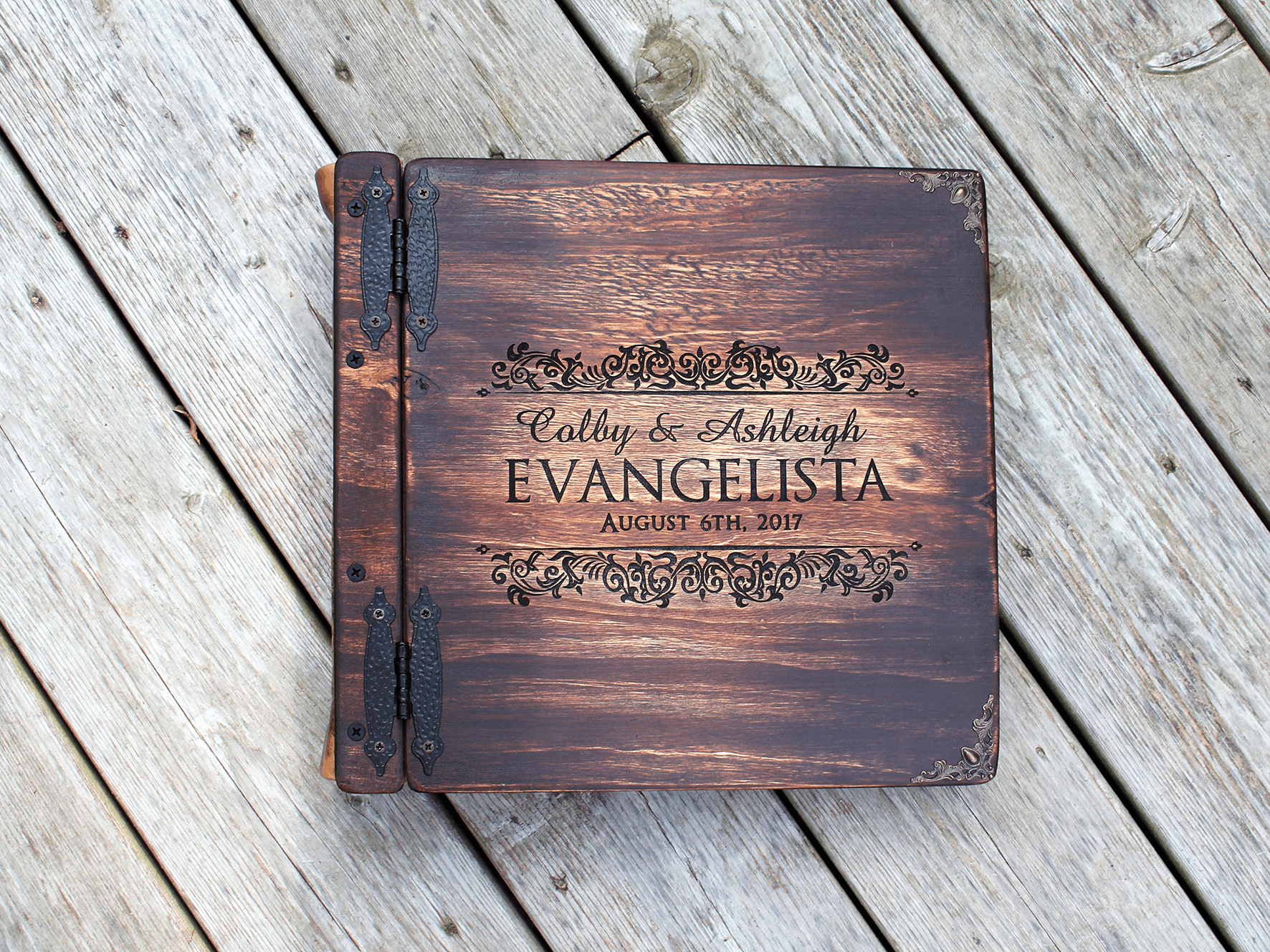 Capture the essence of your love with our custom wedding photo album, engraved by Rustic Engravings and featuring one-of-a-kind artwork by Tylir Wisdom. This exquisite keepsake is perfect for preserving your cherished memories of your special day. Order n